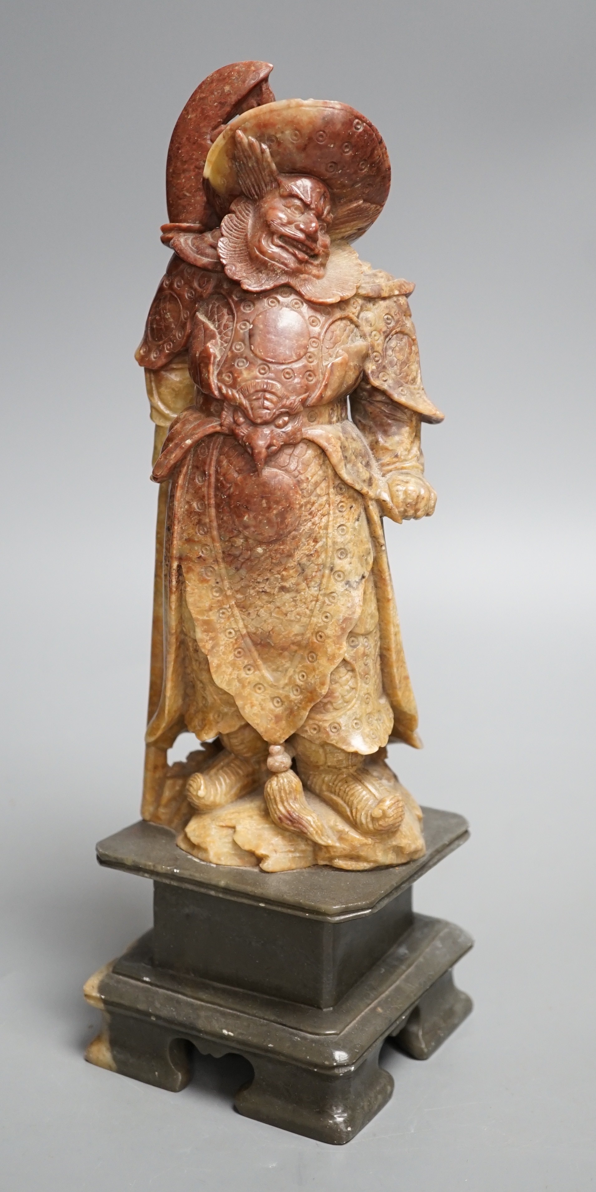 An early 20th century Chinese soapstone carving of Zhong Kui, 30cm high.